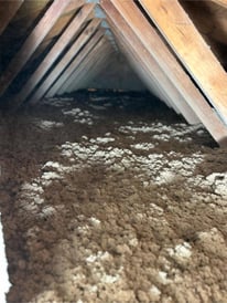 Blown-in cellulose installed in an attic.