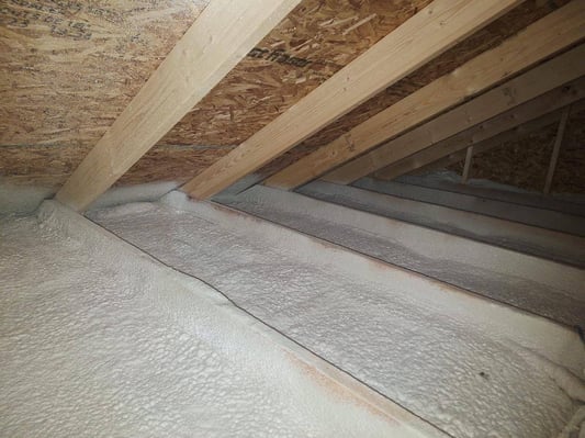 Closed cell spray foam insulation on an attic floor in Newburg, Pennsylvania.