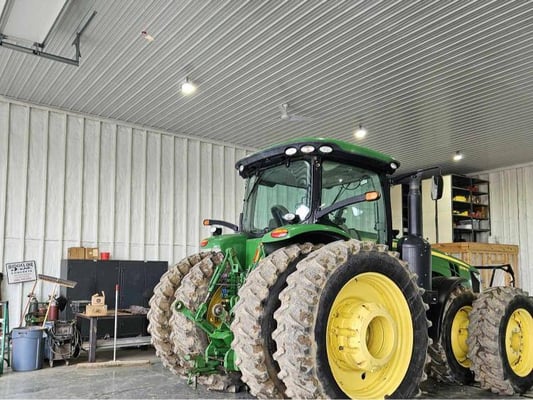 A tractor stored in a metal building that was insulated with closed cell spray foam.