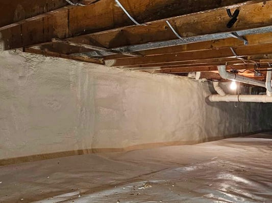 Closed cell spray foam insulation installed on the walls of an encapsulated crawl space.
