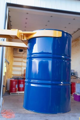 A spray foam component drum being transported from the shop to the spray foam rig via forklift.