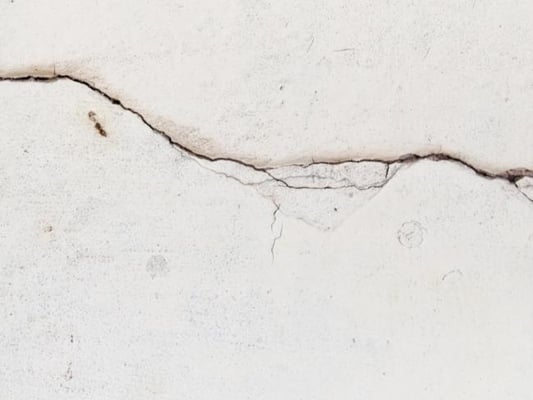 Drywall with cracks and nail pops.