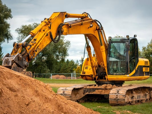 An excavator digging the foundation for a home.