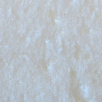 The open cellular structure of open cell spray foam insulation.