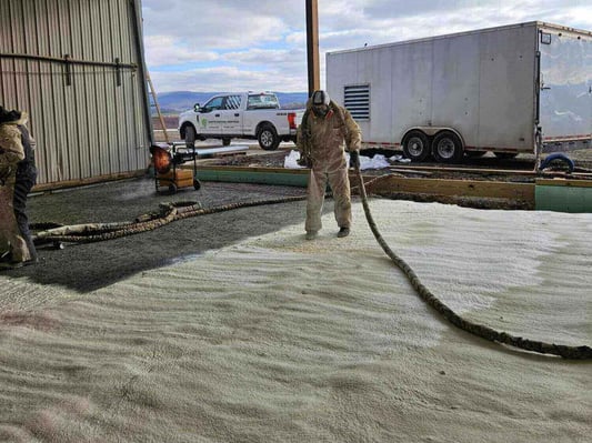 Installing closed cell spray foam on the underslab of a metal building in Franklin County, Pennsylvania.