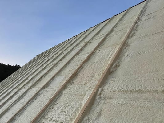 A roof insulated with closed cell spray foam insulation.