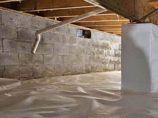 A foundation wall of a home, located in the crawl space. This crawl space is in the process of being encapsulated.