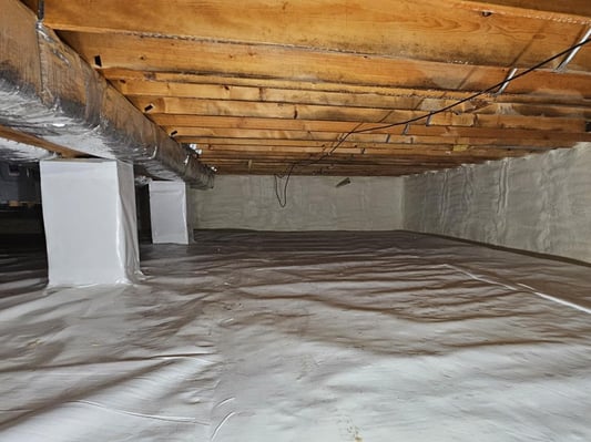 An encapsulated crawl space in Waynesboro, Pennsylvania with wrapped pillars, a vapor barrier floor, and closed cell spray foam on the walls.
