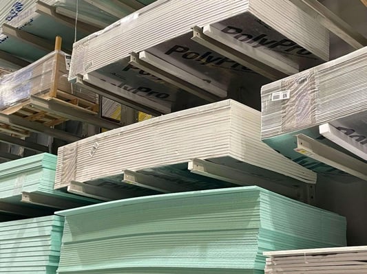 Stacks of foam board insulation available at a home improvement store.