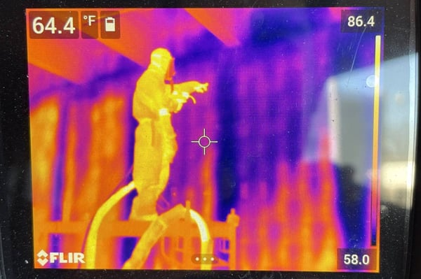 Residential pour foam installation seen through a heat gun. Temperature differences are indicated by purples and oranges.