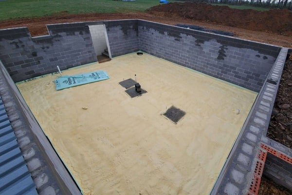 The foundation of a house, or underslab, insulated with closed cell spray foam.