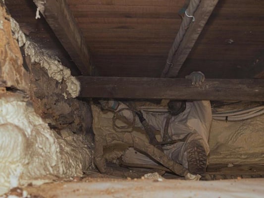 A spray foam contractor insulating crawl space rim joists for a home in Chambersburg, Pennsylvania.