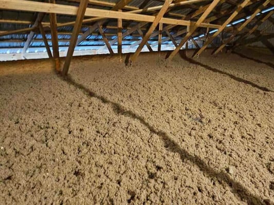 Blown-in cellulose insulation installed in a pole building attic in Pennsylvania.