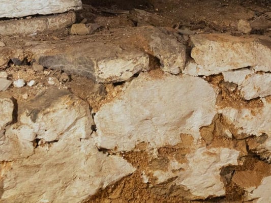 A stone foundation wall.