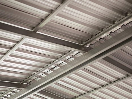 The roof and ridgeline of a metal building.