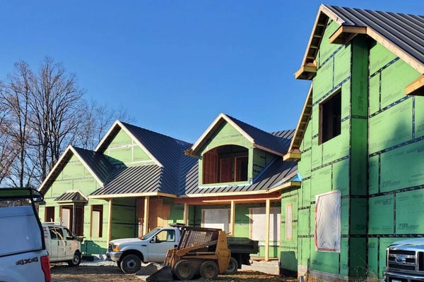 A large new construction home in Pennsylvania, wrapped in green house wrap.