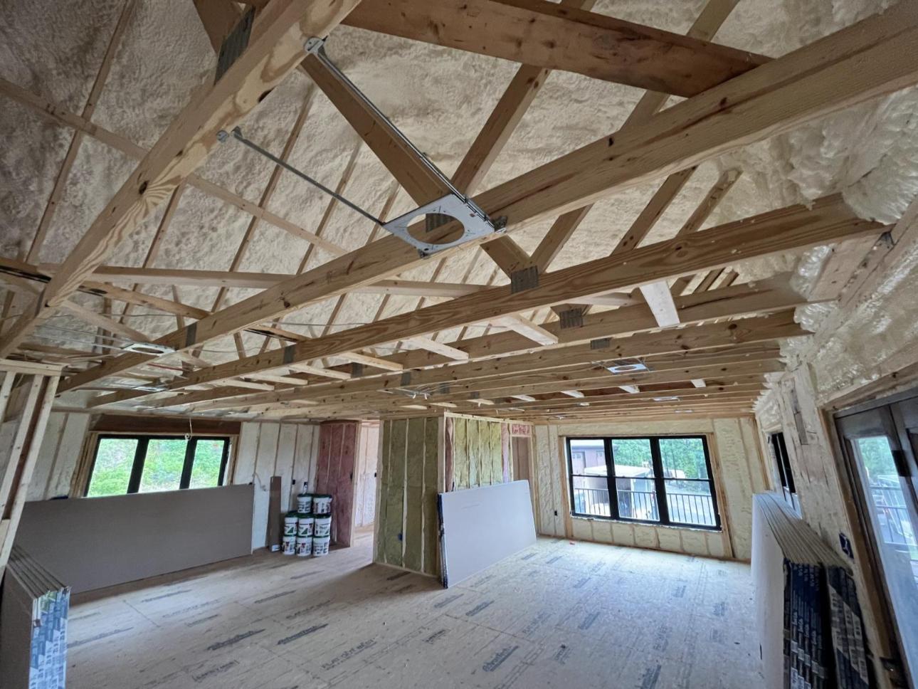 A new construction home insulated with closed cell spray foam, open cell spray foam, and sound attenuation batting.