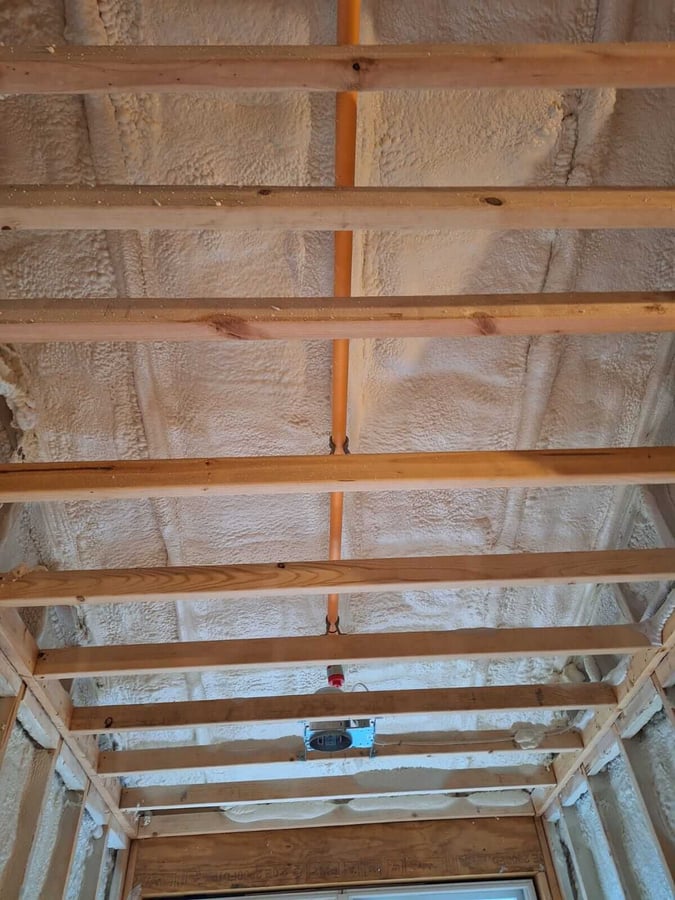 Closed cell spray foam installed in a hallway ceiling in a new build home in Carroll County, Maryland.