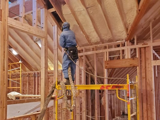 A spray foam insulation contractor installing closed cell spray foam in the roof of a new construction home in Franklin County, PA.