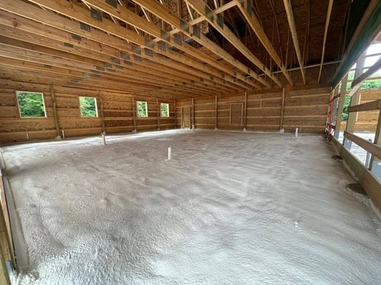 The underslab of a new construction home in Homer City, PA. This closed cell spray foam prevents cold air from infiltrating through the ground.