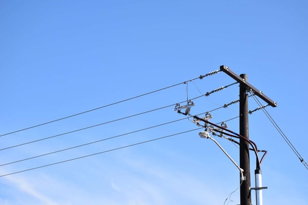 Power Lines Against A Blue Sky